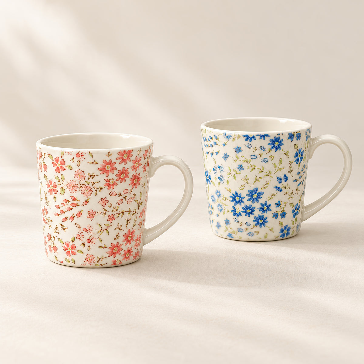 Hana Karakusa floral mug set, blue and pink mugs sold as a pair