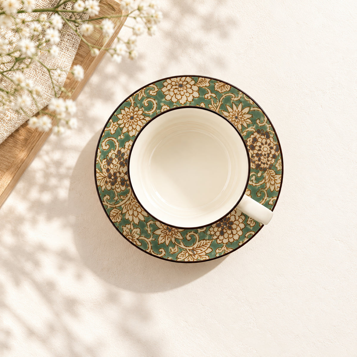 Hana Karakusa Tea Cup & Saucer A Green ceramic cup and saucer