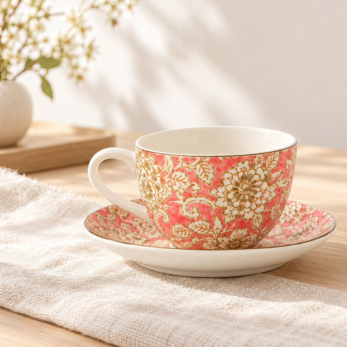 Hana Karakusa Tea Cup & Saucer A Pink ceramic cup and saucer