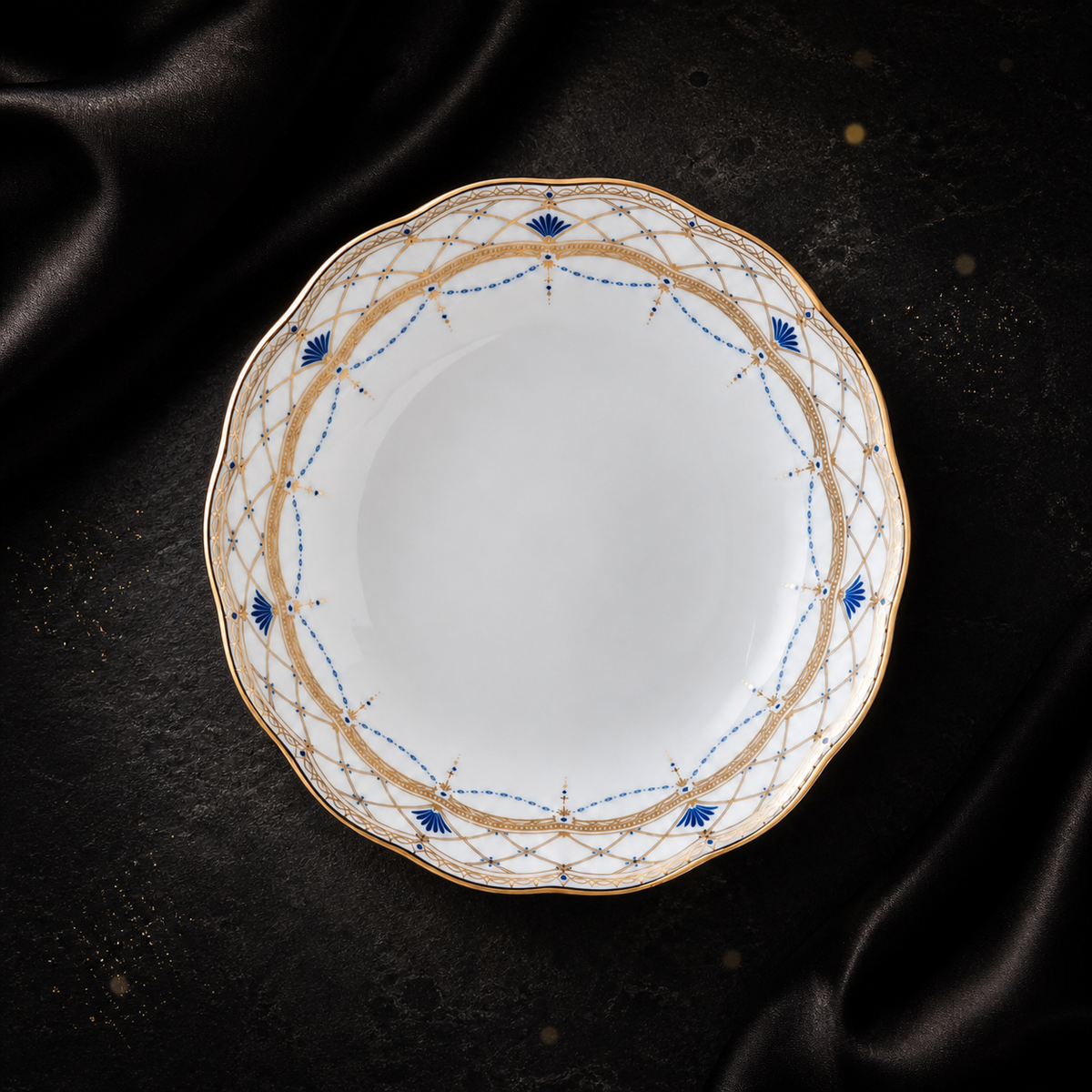 Top view of the Valesse Azure 14.9 cm fruit bowl in white bone china with a scalloped blue-and-gold decorative rim.