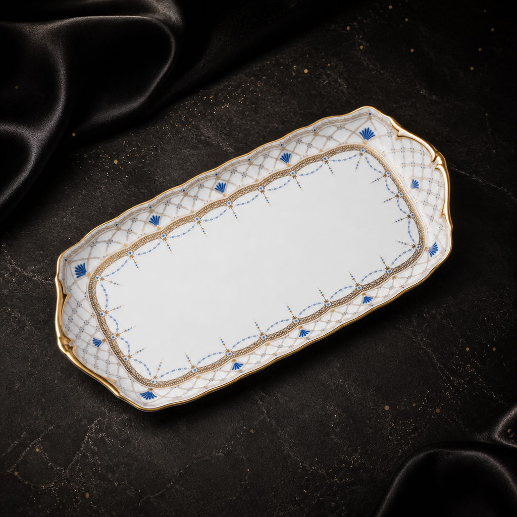 High-angle view of the empty Valesse Azure small tray, showing its elongated shape and blue-and-gold ornament.