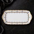 Top view of the Valesse Azure 23 cm small tray, showing its elongated white bone-china form and intricate blue-and-gold border.
